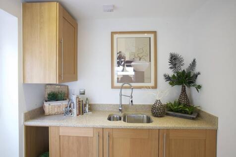 A utility area offers space for laundry appliances and an external door