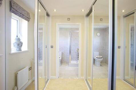 A dedicated dressing area is a nice touch to the main bedroom