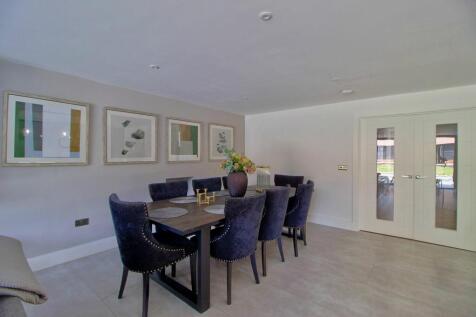 Double doors open from large hallway