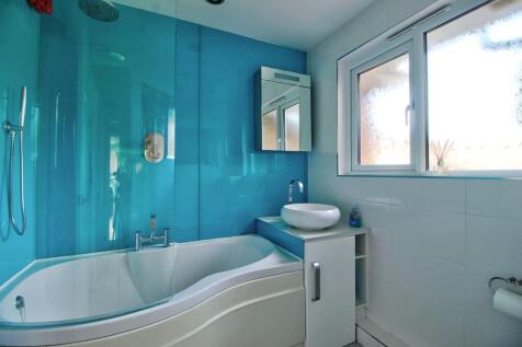 Family bathroom with shower and curved screen