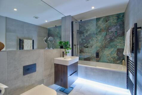 Family bathroom with &#39;floating&#39; bath