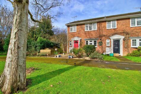 Overlooking Green, with garage to the rear