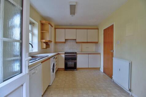 Back door opens to kitchen
