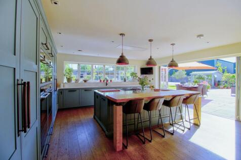 Bifold doors open to sunny south-facing terrace