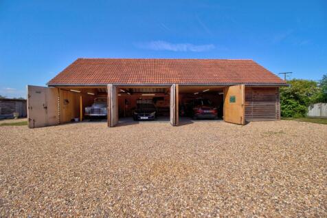 Four bay garage with steel framed doors