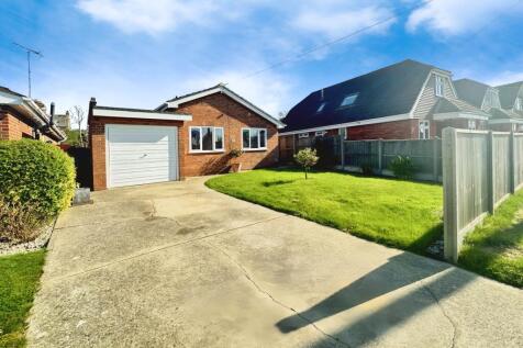 Front View Of The Property With Driveway Parking
