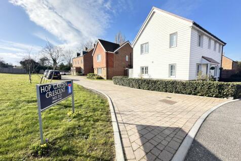 Outside View Of The Property With Driveway Entrance Parking