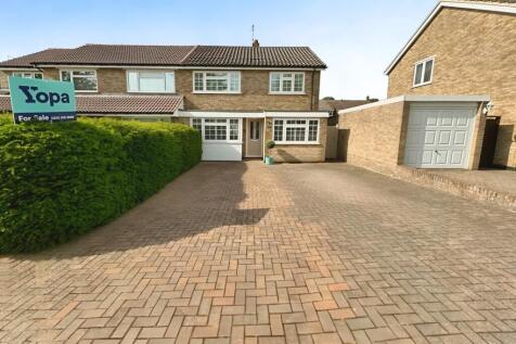Front View Of The Property With Driveway Parking