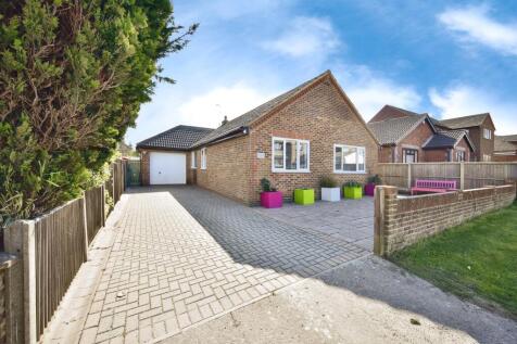 Outside View Of The Property With Driveway Parking