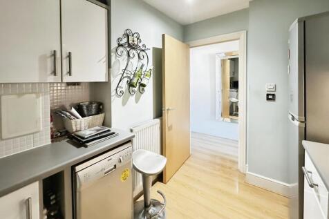 Kitchen With View Of Entrance Hallway