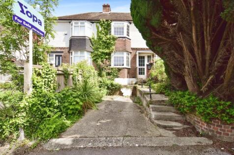 Outside View Of The Property With Driveway Parking