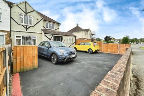 Outside View Of The Property With Driveway Parking