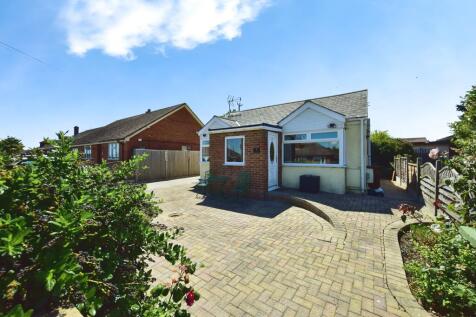 Outside View Of The Property With Driveway Parking
