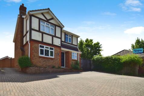 Outside View Of The Property With Driveway Parking