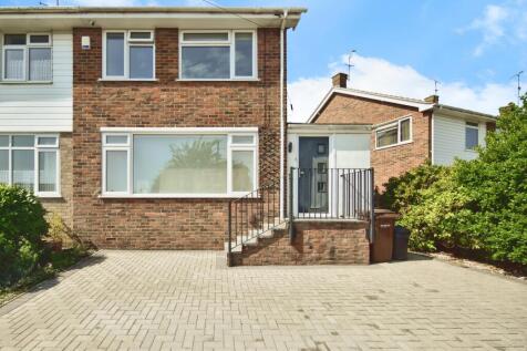 Outside View Of The Property With Driveway Parking