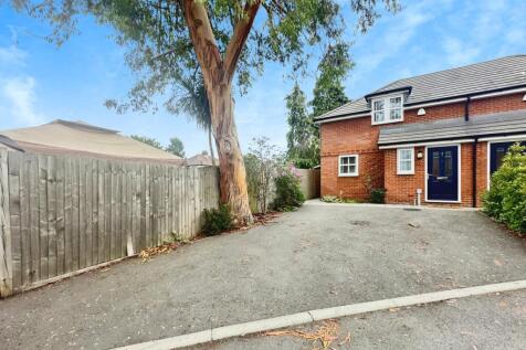 Outside View Of The Property With Driveway Parking