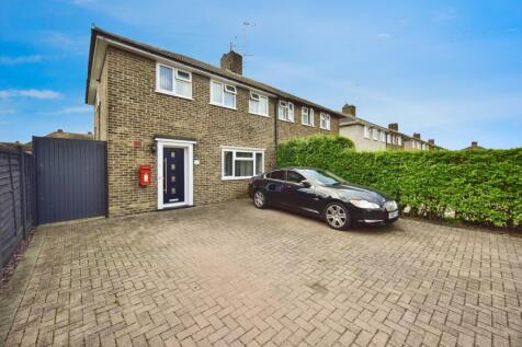 Outside View Of The Property With Driveway Parking