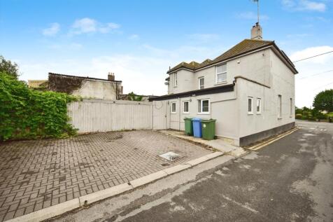 Back Of The Property With Driveway Parking