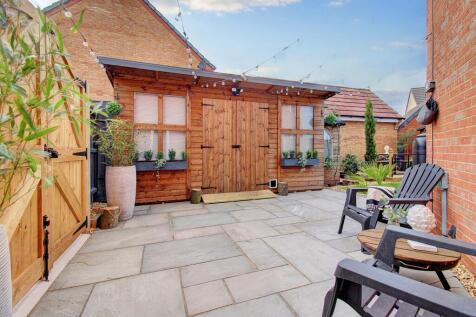 Side Patio &amp; Large Outbuilding