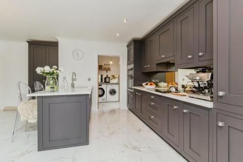 Kitchen leading onto Utility