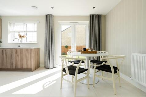 Double doors lead out to the garden from the dining area