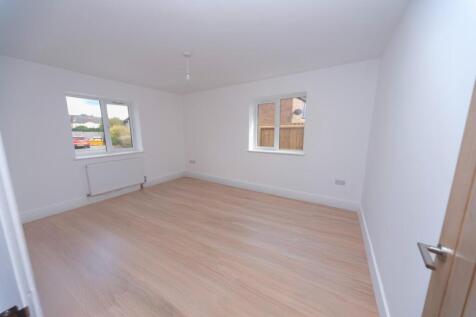 BEDROOM 1 WITH SAMPLE FLOORING.JPG