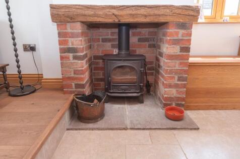 Fireplace in dining area .JPG