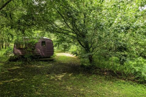 Caravan By Stream