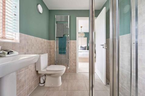 The main bedroom en-suite is your space to relax and prepare for the day ahead