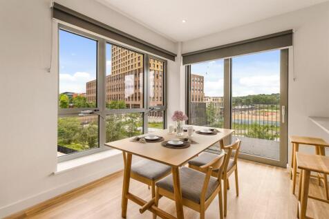 Enjoy meals with a view in this chic dining area, boasting modern furnishings and abundant natural light.