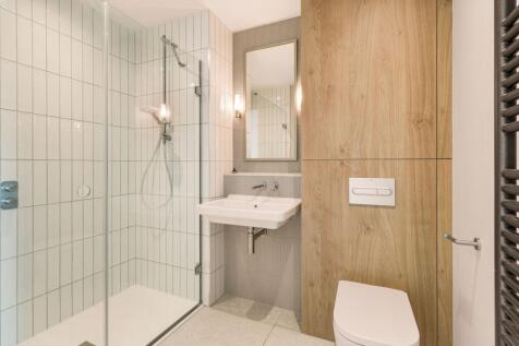 Step into a sleek and modern bathroom that combines style with functionality.