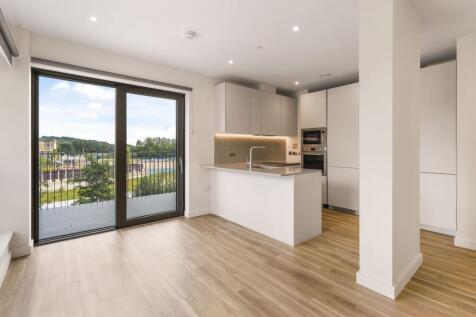 Experience modern living with this open-concept kitchen and stunning balcony views.