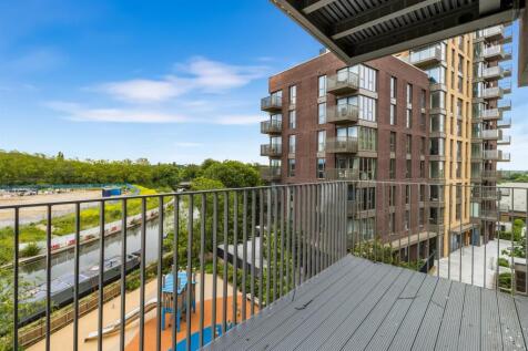 Embrace urban living with serene canal views from your private balcony.