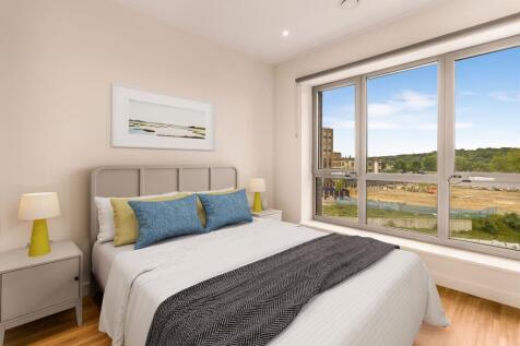 Experience tranquility in this stylish bedroom featuring expansive views.