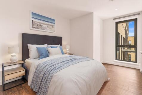 Experience comfort in this beautifully designed bedroom featuring serene decor.