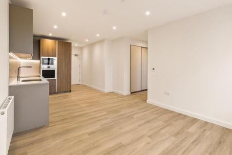 Embrace contemporary living in a stylish apartment featuring an open kitchen and inviting atmosphere.