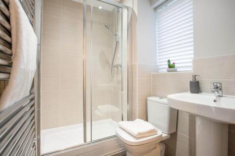 Bedroom 1 also hosts a private en-suite shower room