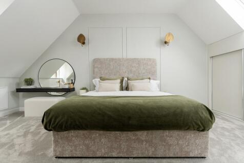 The main bedroom is on the top floor of the house &amp; features an en suite shower room