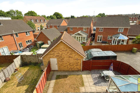 View of garage &amp; garden