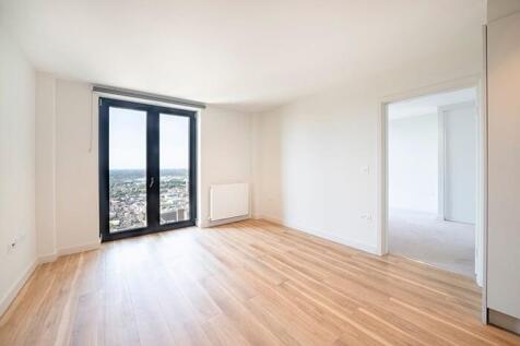 Experience the warmth and openness of this sunlit apartment space, perfect for urban living.