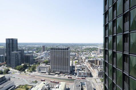 Experience the stunning skyline from this contemporary apartment, offering panoramic views of the vibrant city below.