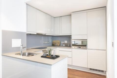 Experience the elegance of a sleek, modern kitchen designed for functionality and style.
