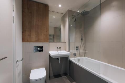 Experience luxury in this sleek, modern bathroom designed for relaxation.