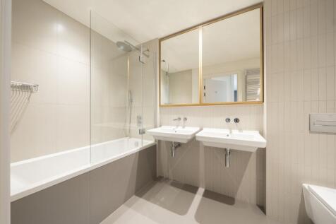 Indulge in the tranquility of this beautifully designed bathroom with contemporary fittings.