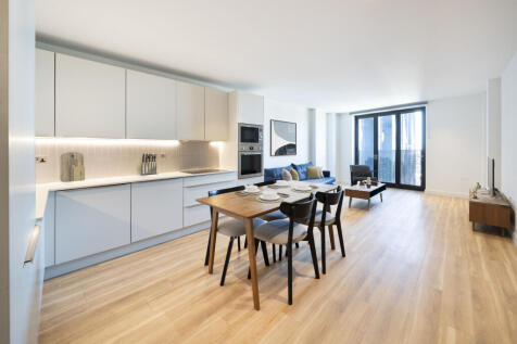 Experience modern living with this sleek, open-plan kitchen and living space, perfect for entertaining.