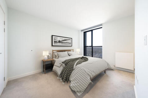 Experience tranquility in this bright and modern bedroom, designed for relaxation.