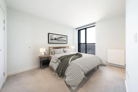 Experience tranquility in this bright and modern bedroom, designed for relaxation.