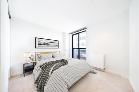 Relax in this elegantly designed bedroom featuring contemporary touches and ample natural light.