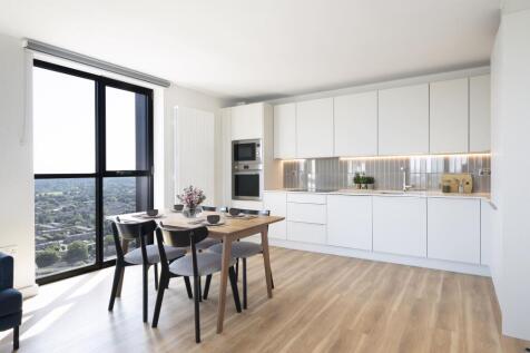Experience elegance in this sleek modern kitchen, perfect for culinary creativity and dining.