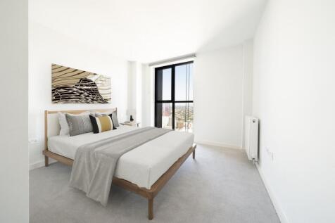 Experience relaxation and style in this elegant bedroom with panoramic city vistas.